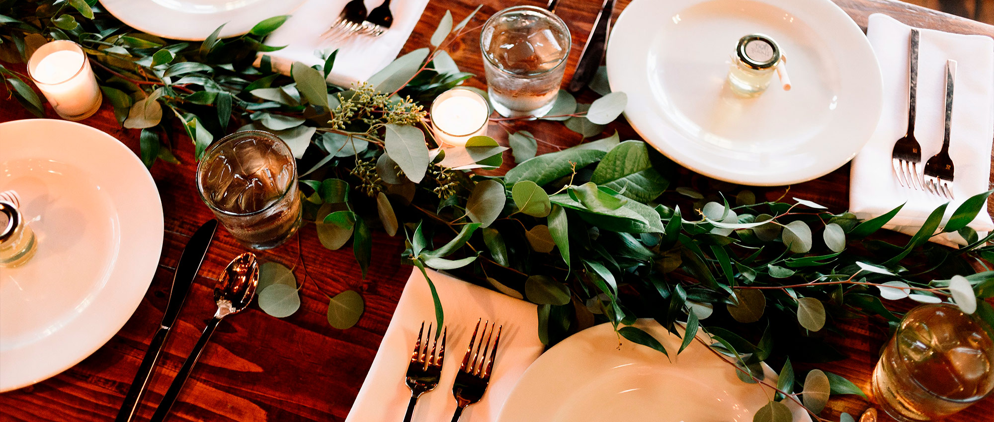 Nicely set table with greenery artfully displayed